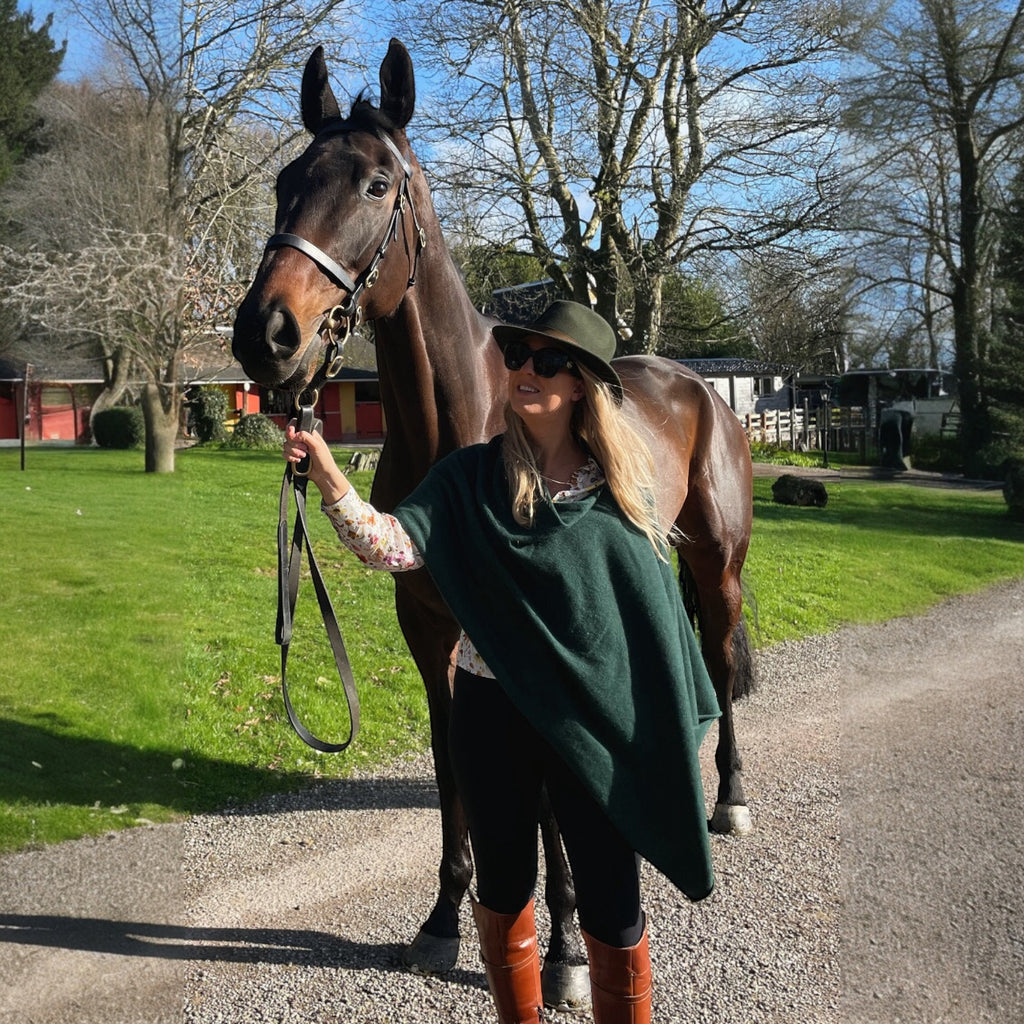 Ladies Moss Green 100% Pure Cashmere Multiway Poncho by Kenmare Cashmere styled with tan boots and leggings
