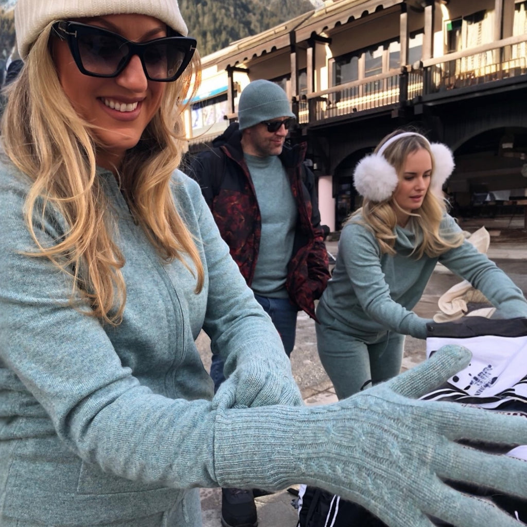 Model wearing sea green cable knit cashmere gloves by Kenmare Cashmere